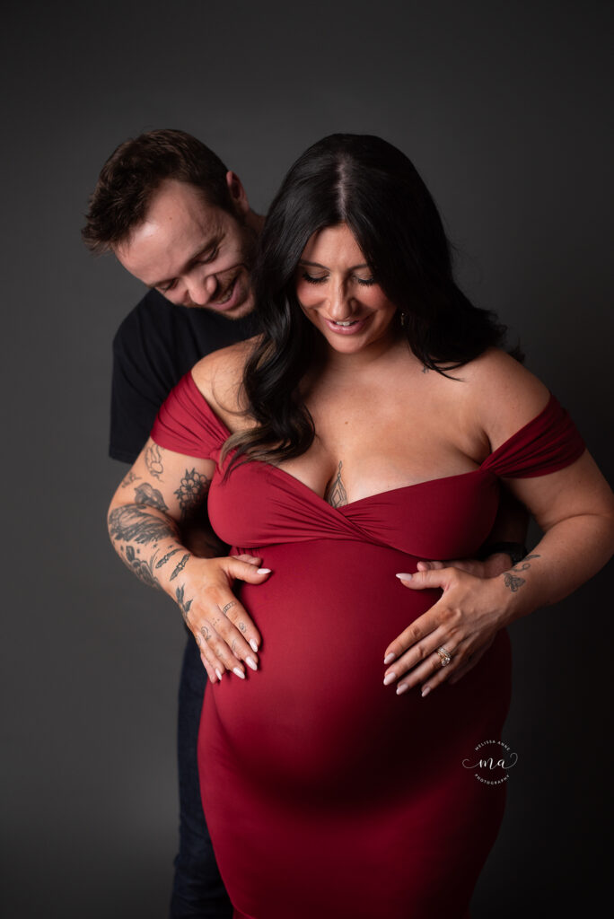 Troy Michigan maternity newborn photographer Melissa Anne Photography maternity session in studio with couture gown