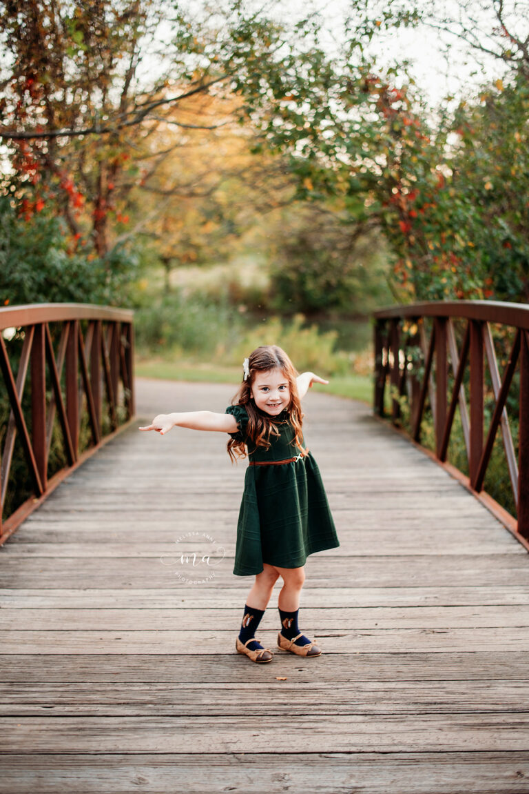 Metro-Detroit-Michigan-family-photographer-Melissa-Anne-Photography-little-girl-dancing-on-bridge-in-park