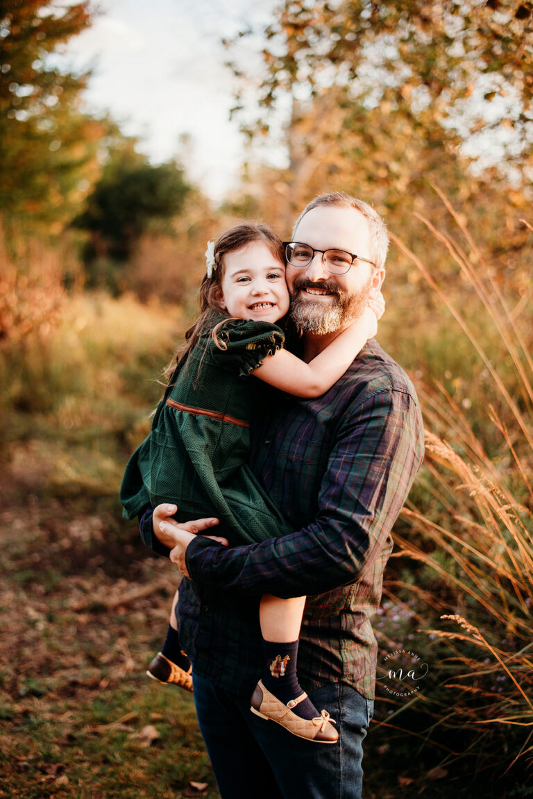 Troy Michigan family photographer Melissa Anne Photography dad holding daughter in park